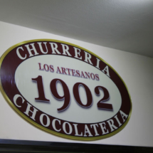 Logo de la chocolatería Los Artesanos 1902 de Madrid